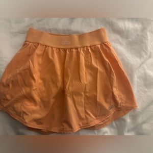 Orange mini tennis skirt
